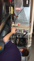 HVAC Contractor Examining Inside of Ductwork